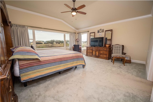 carpeted bedroom with vaulted ceiling, ceiling fan, and ornamental molding