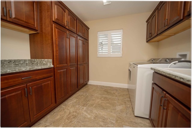 washroom with cabinets and separate washer and dryer