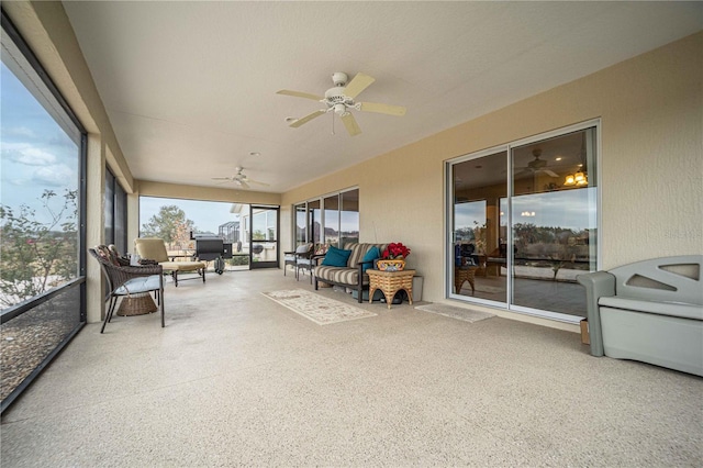 sunroom / solarium with ceiling fan