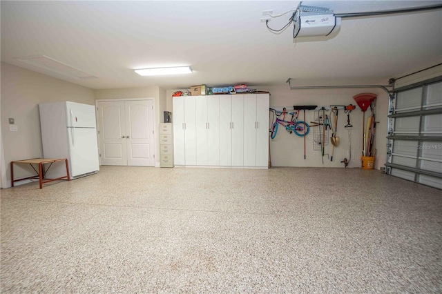 garage with a garage door opener and white refrigerator