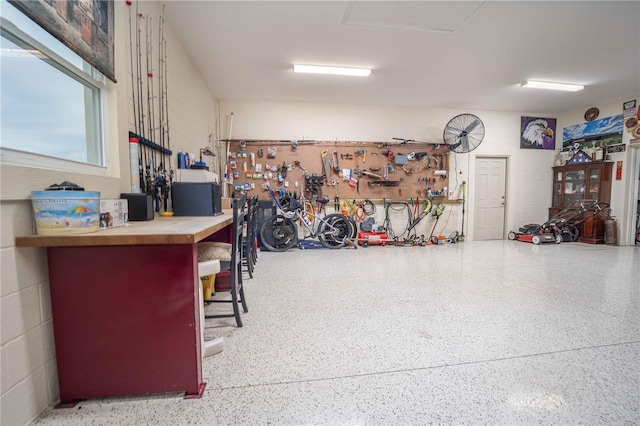 garage with a workshop area