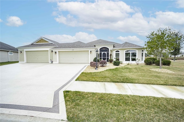 view of front of home featuring a front lawn and a garage