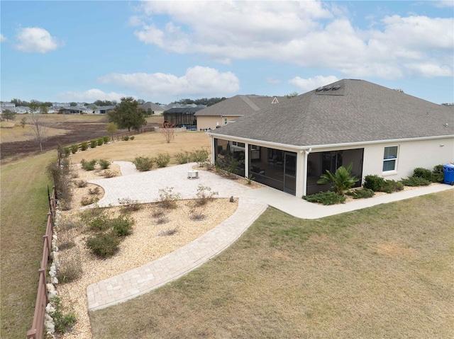 view of yard with a sunroom