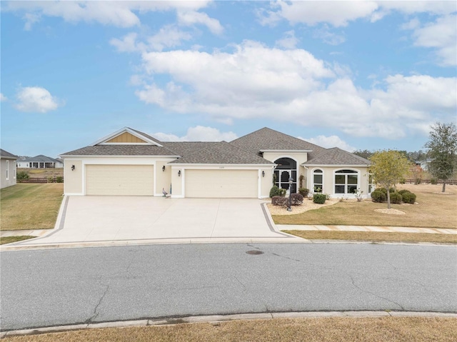 view of front of home featuring a front lawn and a garage