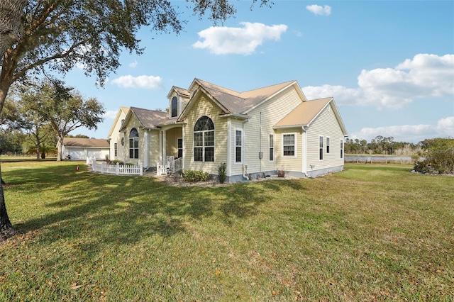 back of property featuring a lawn