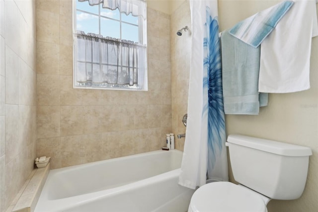 bathroom with shower / bathtub combination with curtain and toilet