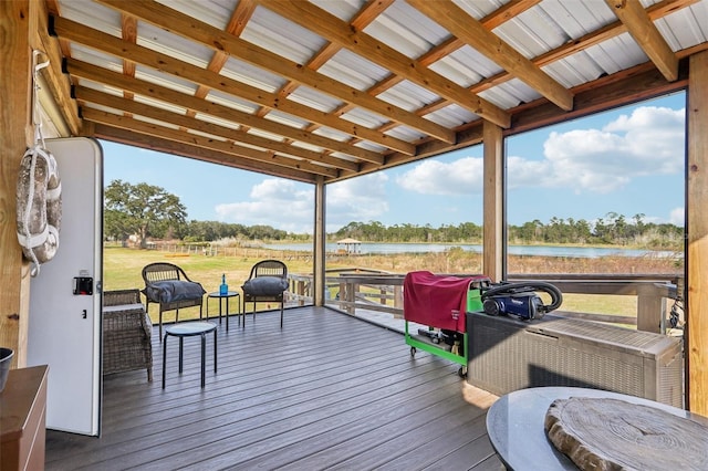 wooden deck featuring a water view