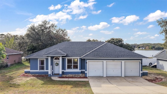 ranch-style home with a front yard and a garage