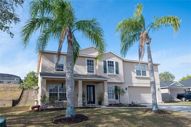 view of front facade with a front yard and a garage