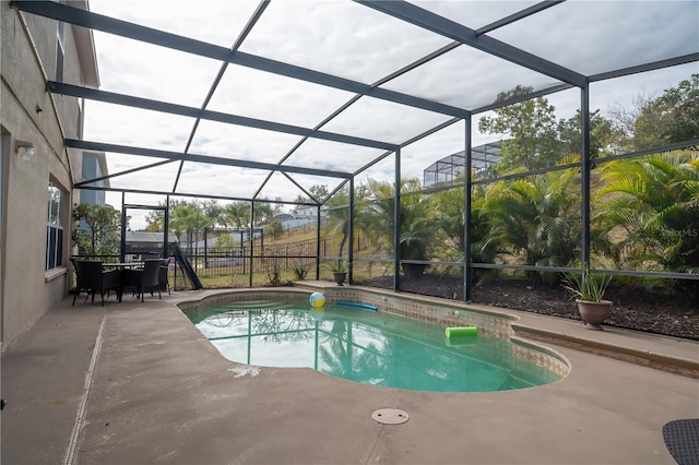 view of pool featuring a lanai and a patio