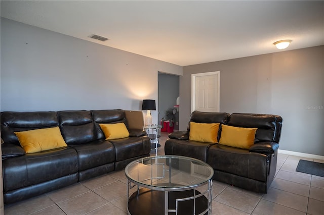 living room with tile patterned floors