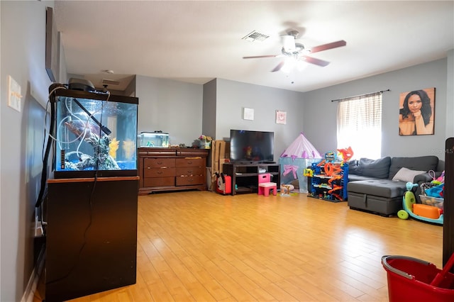 game room featuring ceiling fan and light hardwood / wood-style flooring