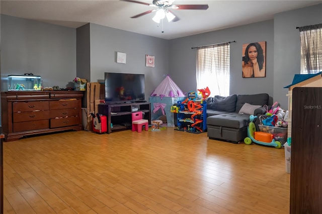 rec room featuring ceiling fan and light hardwood / wood-style flooring