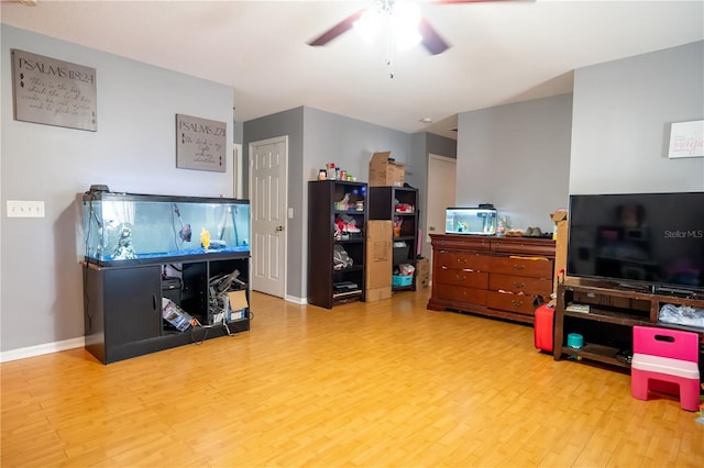 miscellaneous room featuring ceiling fan and hardwood / wood-style flooring