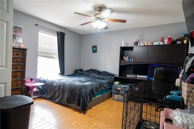 bedroom featuring ceiling fan and hardwood / wood-style flooring