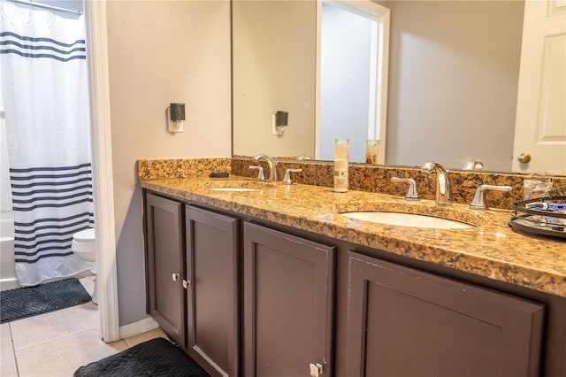 full bathroom featuring toilet, tile patterned flooring, vanity, and shower / bath combo with shower curtain