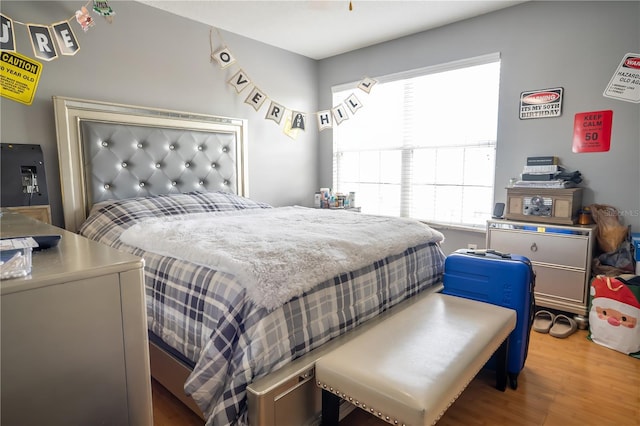 bedroom with hardwood / wood-style floors