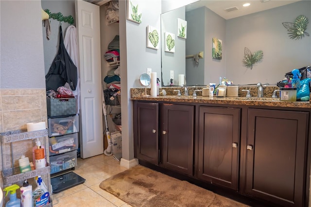 bathroom featuring vanity and tile patterned flooring