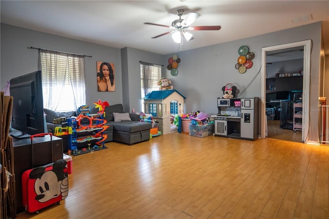 rec room featuring hardwood / wood-style flooring and ceiling fan