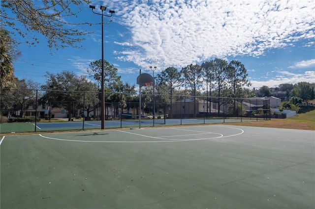 view of sport court featuring tennis court