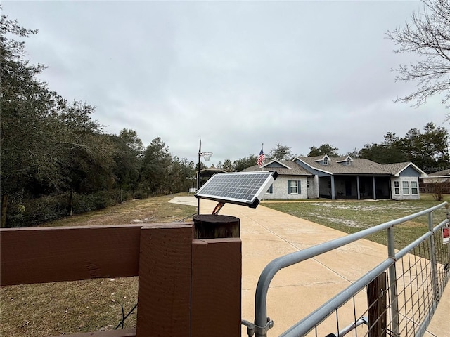 view of front of house featuring solar panels