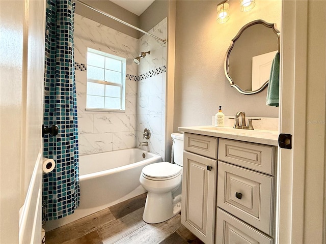 full bathroom featuring hardwood / wood-style flooring, vanity, toilet, and shower / tub combo