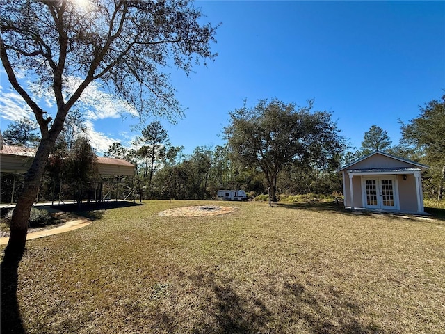 view of yard with french doors