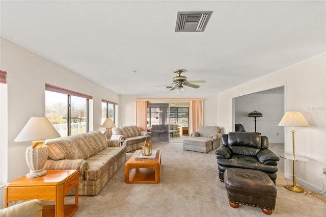 living room with light colored carpet and ceiling fan