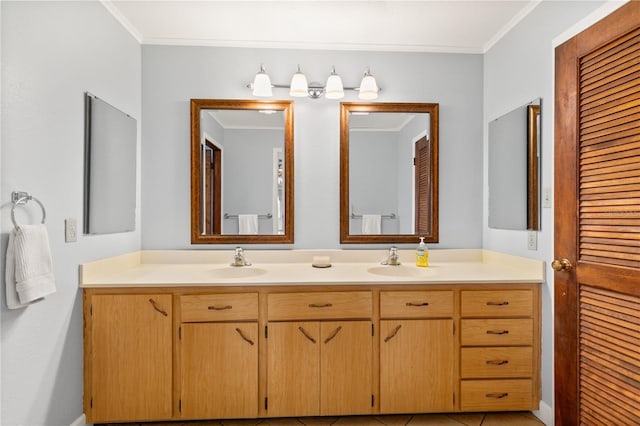 bathroom featuring tile patterned flooring, vanity, and crown molding