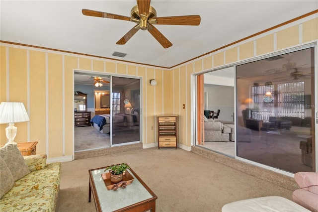 living room with crown molding and carpet