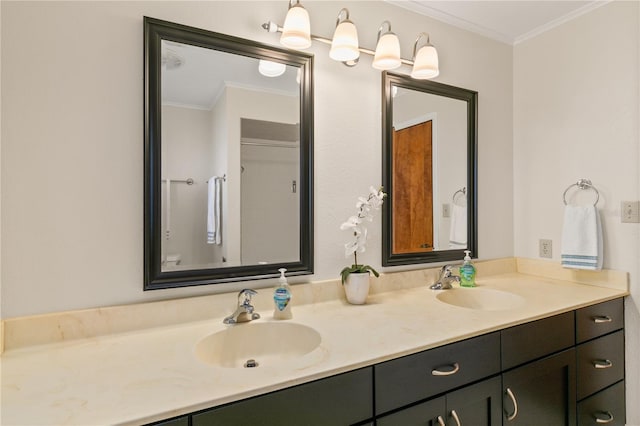 bathroom with ornamental molding and vanity