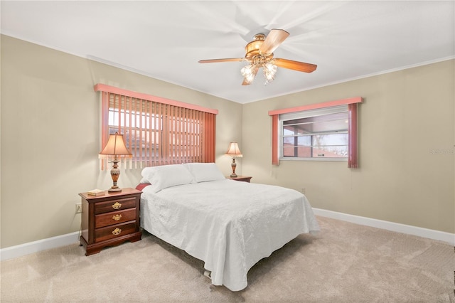 bedroom featuring ceiling fan and light carpet