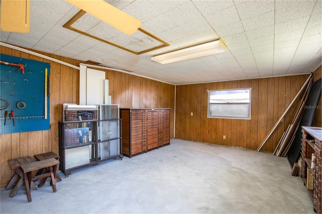 misc room featuring wood walls