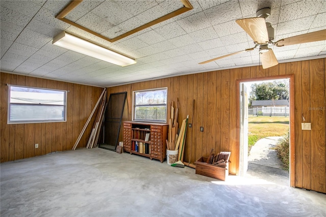 miscellaneous room with wood walls