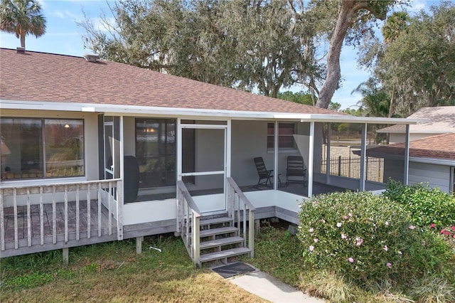 back of property featuring a sunroom