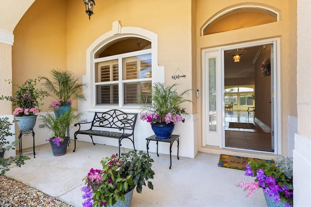 entrance to property featuring a porch