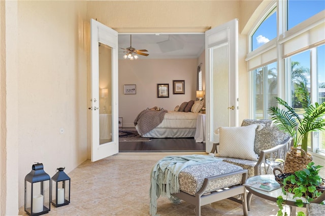 bedroom featuring crown molding, ceiling fan, and french doors