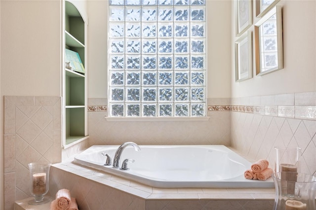 bathroom with tiled tub