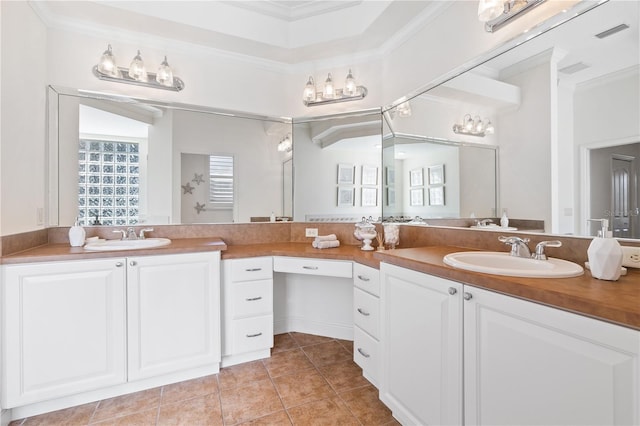 bathroom featuring vanity, ornamental molding, and tile patterned floors