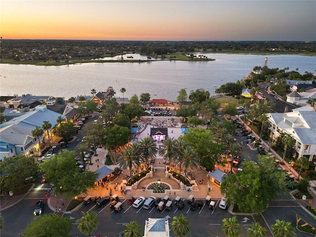 aerial view at dusk with a water view