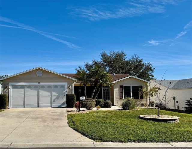 ranch-style home with a garage and a front lawn