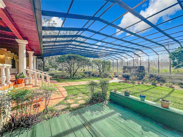 wooden terrace with a pergola and a yard