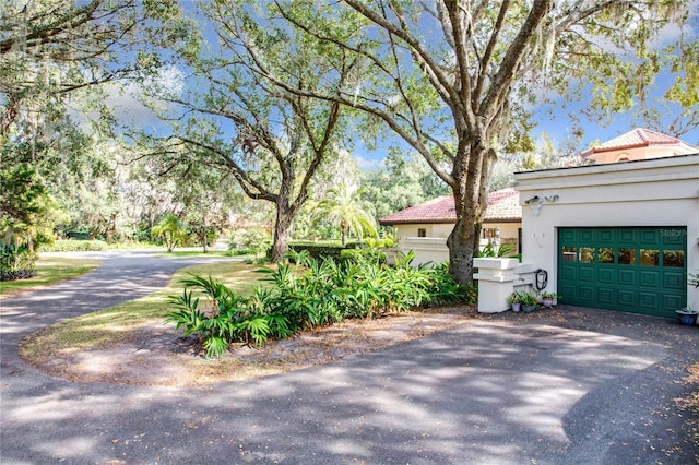 view of side of home with a garage