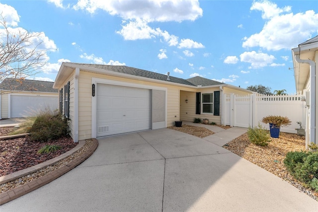 ranch-style house featuring a garage