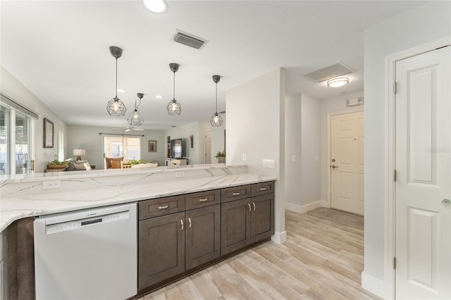 kitchen with decorative light fixtures, dark brown cabinets, light wood-type flooring, white dishwasher, and light stone countertops