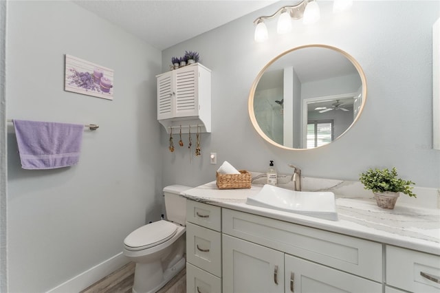 bathroom featuring hardwood / wood-style flooring, vanity, and toilet