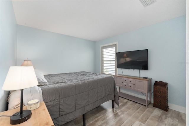 bedroom featuring light hardwood / wood-style floors