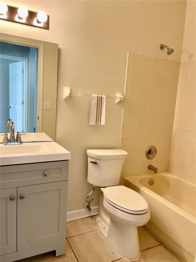 full bathroom with shower / bath combination, tile patterned floors, toilet, and vanity