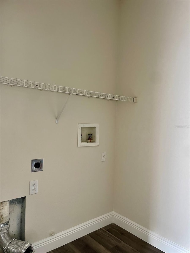 washroom with washer hookup, dark wood-type flooring, electric dryer hookup, and hookup for a gas dryer