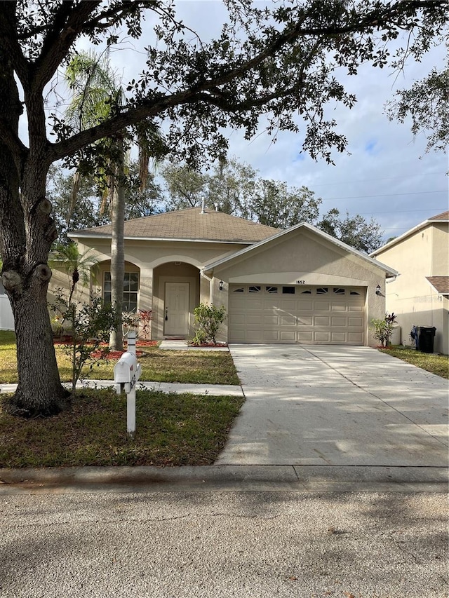 single story home with a garage